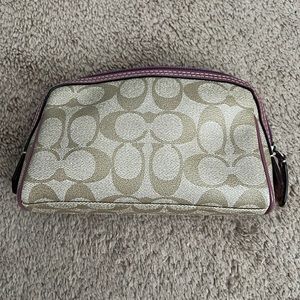 Gently used Coach cosmetic case.